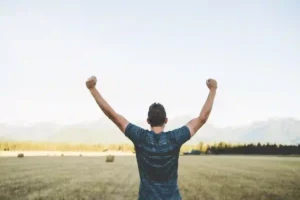 Man celebrating, arms in the air, can use record types with PolySharp